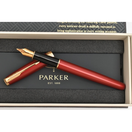 102 - A 'PARKER' SONNET FOUNTAIN PEN, a boxed red fountain pen, signed 'Parker', nib signed 'Parker', (con... 