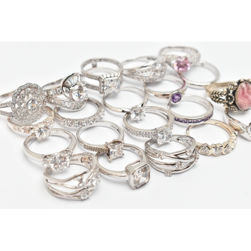 106 - A BAG OF TWENTY WHITE METAL RINGS, of various designs most set with cubic zirconia, one set with a r... 