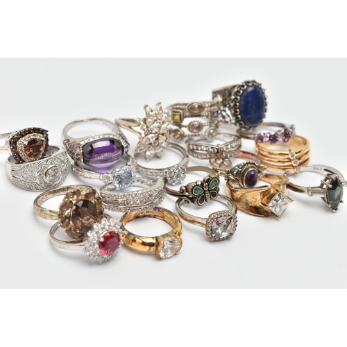 118 - A BAG OF TWENTY RINGS, to include seventeen white metal rings of various designs, most set with cubi... 