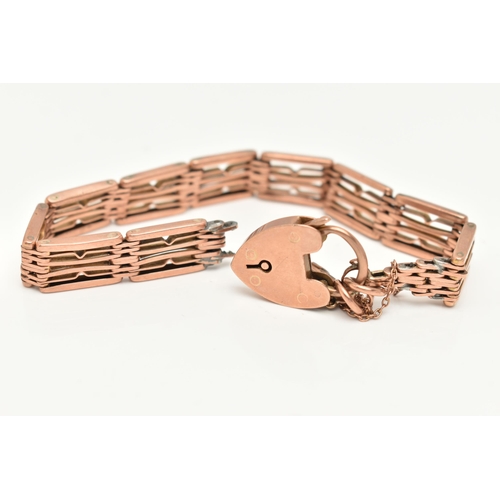 126 - A BRACELET, designed as wire panels with a heart shape padlock clasp and safety chain, bracelet brok... 