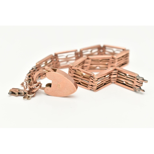 126 - A BRACELET, designed as wire panels with a heart shape padlock clasp and safety chain, bracelet brok... 