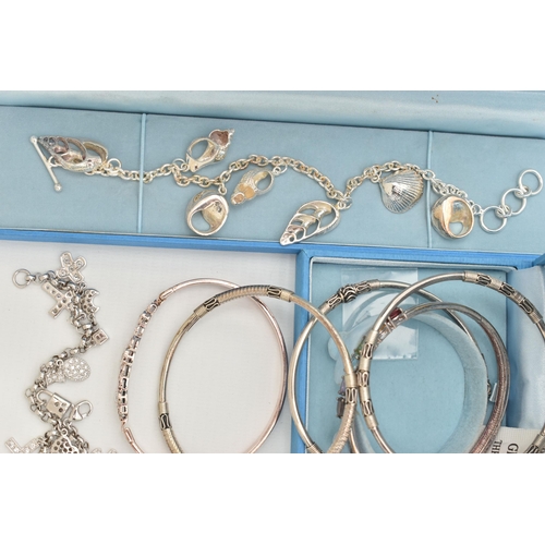 140 - A SELECTION OF BRACELETS, to include a silver seashell charm bracelet, fitted with a toggle clasp, h... 