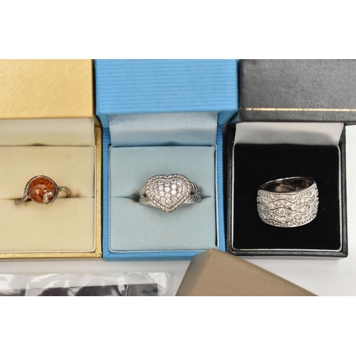 141 - A COLLECTION OF BOXED WHITE METAL RINGS, to include thirteen rings of various designs, some set with... 