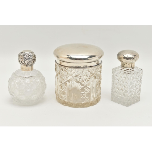 148 - TWO GLASS SCENT BOTTLES AND A TOILET JAR, to include a small round glass scent bottle with screw on ... 