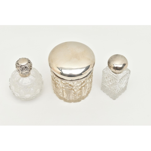 148 - TWO GLASS SCENT BOTTLES AND A TOILET JAR, to include a small round glass scent bottle with screw on ... 