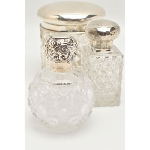 148 - TWO GLASS SCENT BOTTLES AND A TOILET JAR, to include a small round glass scent bottle with screw on ... 