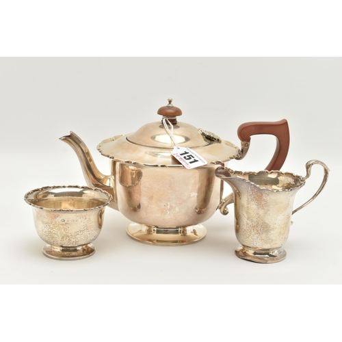 151 - A GEORGE VI SILVER THREE PIECE TEA SET, comprising of a polished form with wavy rim teapot, hinged c... 