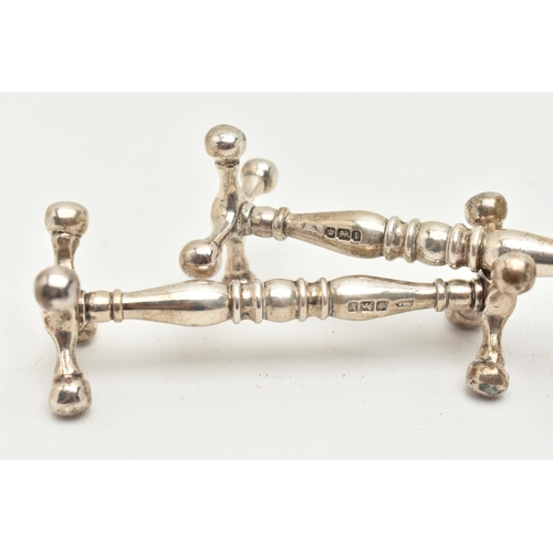 156 - A PAIR OF EARLY 20TH CENTURY SILVER KNIFE RESTS, each hallmarked 'Walker & Hall' Sheffield 1902, app... 