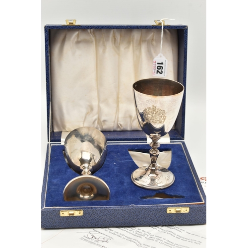 162 - A PAIR OF ELIZABETH II SILVER GOBLETS, engraved with a coats of arms, knopped stem on a round base e... 