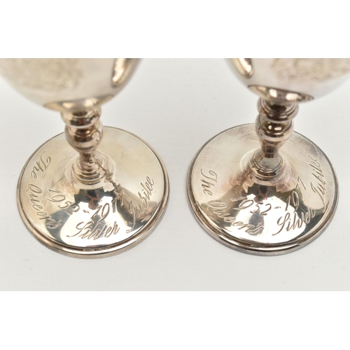 162 - A PAIR OF ELIZABETH II SILVER GOBLETS, engraved with a coats of arms, knopped stem on a round base e... 