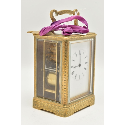 163 - A LATE 19TH CENTURY AUGUSTE OF PARIS STRIKING BRASS CASED CARRIAGE CLOCK, the handle and case ornate... 