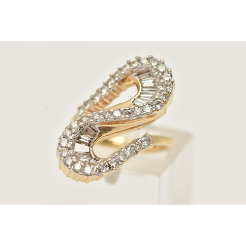 177 - A MODERN DIAMOND DRESS RING, the ring is of an abstract design, set with graduating tapered baguette... 