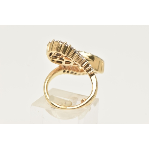 177 - A MODERN DIAMOND DRESS RING, the ring is of an abstract design, set with graduating tapered baguette... 