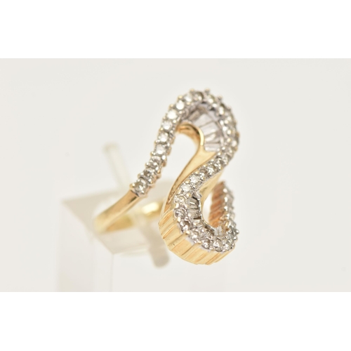 177 - A MODERN DIAMOND DRESS RING, the ring is of an abstract design, set with graduating tapered baguette... 