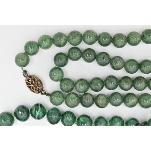 180 - TWO GEMSTONE BEADED NECKLACES, the first a malachite necklace, designed as graduated beads, fitted w... 