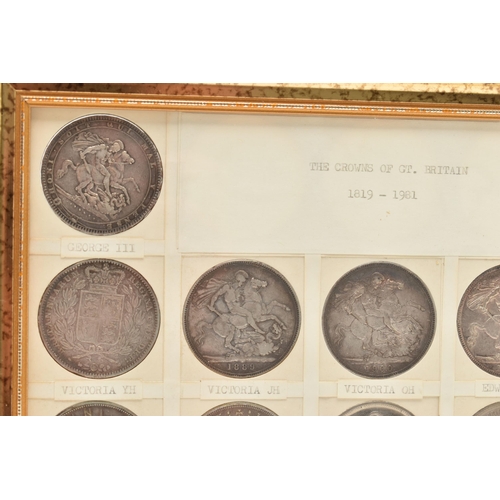 207 - A GLAZED DISPLAY OF CROWN COINS AND COMMEMORATIVES, to include George III Crown 1819 slight ding 10 ... 