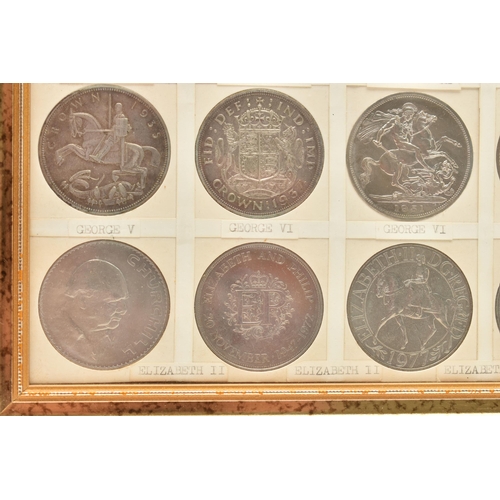 207 - A GLAZED DISPLAY OF CROWN COINS AND COMMEMORATIVES, to include George III Crown 1819 slight ding 10 ... 