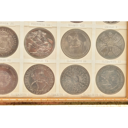 207 - A GLAZED DISPLAY OF CROWN COINS AND COMMEMORATIVES, to include George III Crown 1819 slight ding 10 ... 