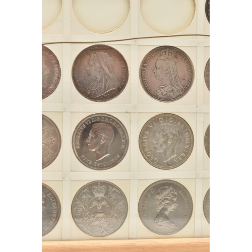 207 - A GLAZED DISPLAY OF CROWN COINS AND COMMEMORATIVES, to include George III Crown 1819 slight ding 10 ... 