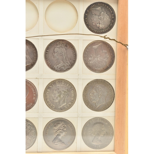 207 - A GLAZED DISPLAY OF CROWN COINS AND COMMEMORATIVES, to include George III Crown 1819 slight ding 10 ... 