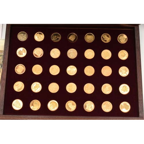 211 - A COLLECTION OF 69 SILVER GILT MEDALS PORTRAYING MOARCHS OFFA- ELIZABETH II, housed in a two drawer ... 