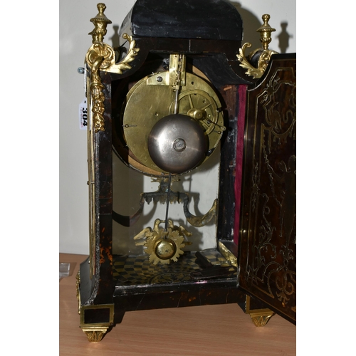 304 - A FRENCH BOULLE NINETEENTH-CENTURY MANTEL CLOCK fitted in an elaborate brass inlaid case with a cast... 