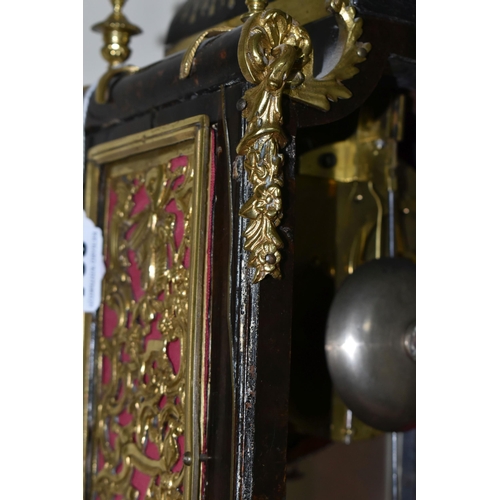 304 - A FRENCH BOULLE NINETEENTH-CENTURY MANTEL CLOCK fitted in an elaborate brass inlaid case with a cast... 