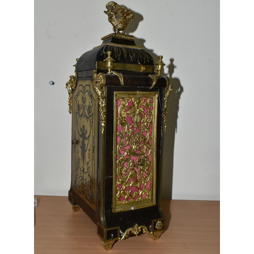 304 - A FRENCH BOULLE NINETEENTH-CENTURY MANTEL CLOCK fitted in an elaborate brass inlaid case with a cast... 