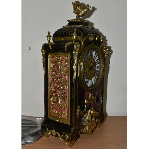 304 - A FRENCH BOULLE NINETEENTH-CENTURY MANTEL CLOCK fitted in an elaborate brass inlaid case with a cast... 