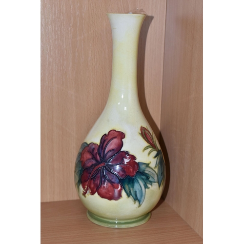 305 - A YELLOW MOORCROFT HIBISCUS PATTERNED BOTTLE VASE with tube lined hibiscus pattern, a Queen Mary lab... 