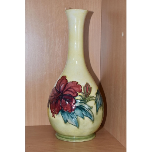 305 - A YELLOW MOORCROFT HIBISCUS PATTERNED BOTTLE VASE with tube lined hibiscus pattern, a Queen Mary lab... 