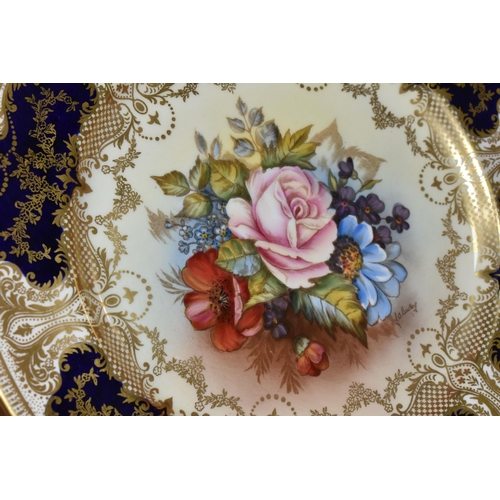 309 - AN AYNSLEY PRINTED AND TINTED PORCELAIN CABINET PLATE with a J.A.Bailey signature, with central flor... 