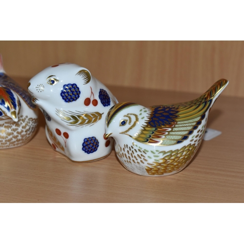 310 - A GROUP OF FOUR ROYAL CROWN DERBY PAPERWEIGHTS comprising a Harvest Mouse with a gold stopper,  a sa... 