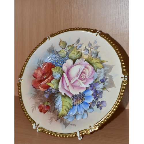 311 - AN AYNSLEY PRINTED AND TINTED PORCELAIN CABINET PLATE with a J.A.Bailey signature, with a floral pat... 