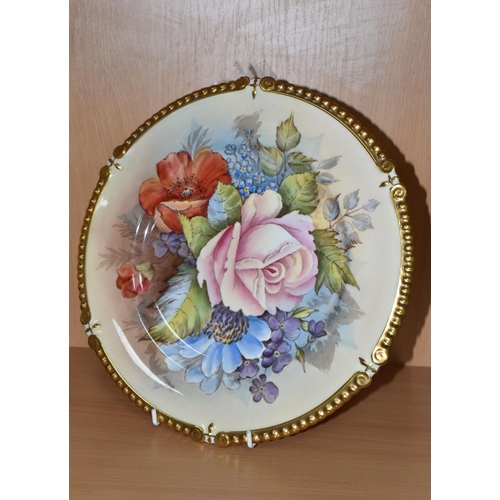 313 - AN AYNSLEY PRINTED AND TINTED PORCELAIN CABINET PLATE with a J.A.Bailey signature, with a floral pat... 