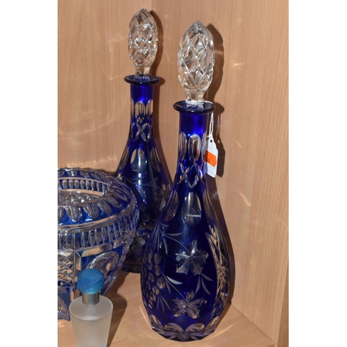 333 - A GROUP OF COLOURED GLASSWARE, comprising two cobalt blue cut to clear glass decanters, a blue cut g... 