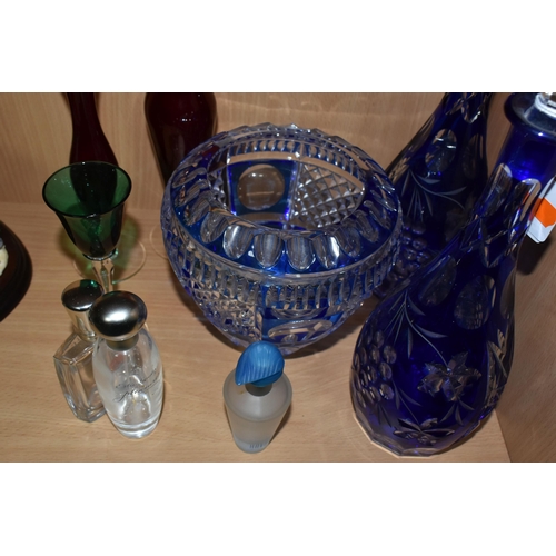 333 - A GROUP OF COLOURED GLASSWARE, comprising two cobalt blue cut to clear glass decanters, a blue cut g... 