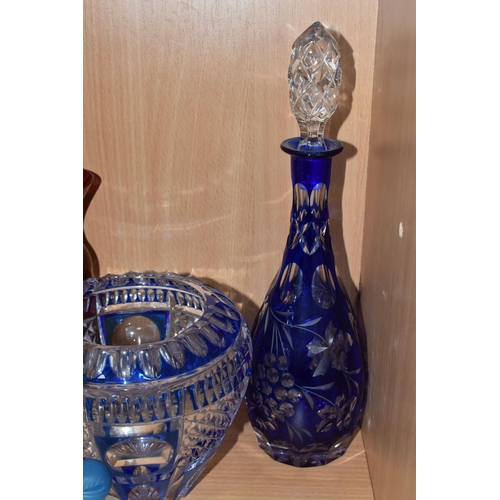 333 - A GROUP OF COLOURED GLASSWARE, comprising two cobalt blue cut to clear glass decanters, a blue cut g... 