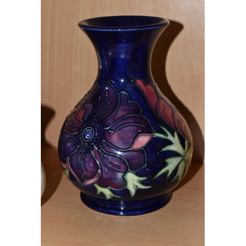 339 - FOUR PIECES OF MOORCROFT POTTERY, comprising an Anemone pattern baluster vase, tube lined with pink ... 