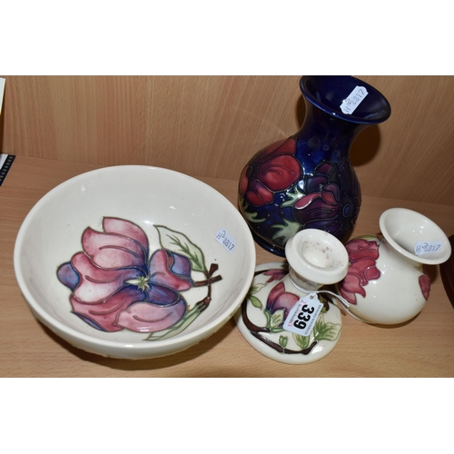 339 - FOUR PIECES OF MOORCROFT POTTERY, comprising an Anemone pattern baluster vase, tube lined with pink ... 