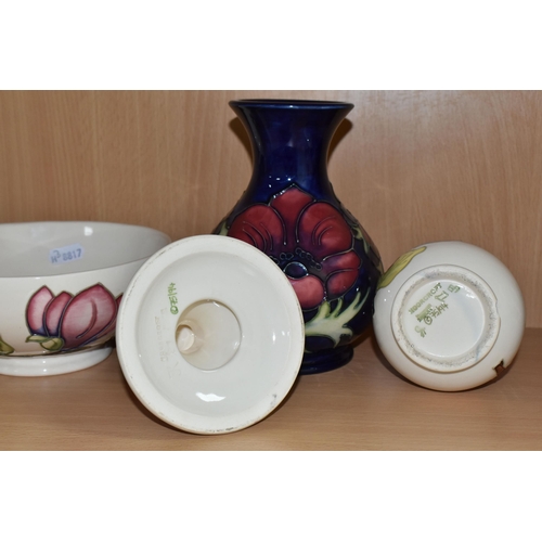 339 - FOUR PIECES OF MOORCROFT POTTERY, comprising an Anemone pattern baluster vase, tube lined with pink ... 