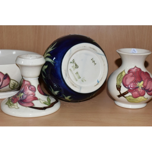 339 - FOUR PIECES OF MOORCROFT POTTERY, comprising an Anemone pattern baluster vase, tube lined with pink ... 