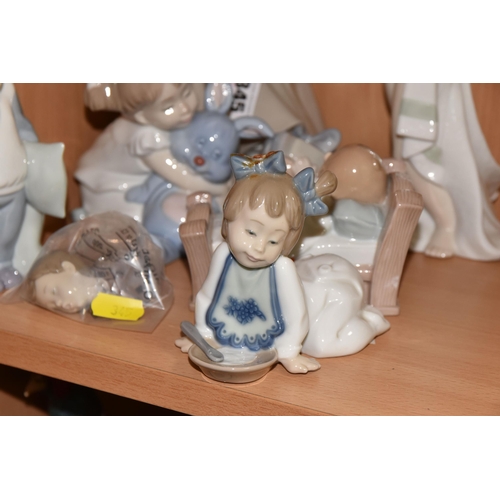 345 - A LLADRO FIGURE AND A GROUP OF NAO FIGURES, comprising Lladro Girl with Doves/ Pigeons, no 4915, scu... 