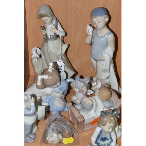 345 - A LLADRO FIGURE AND A GROUP OF NAO FIGURES, comprising Lladro Girl with Doves/ Pigeons, no 4915, scu... 