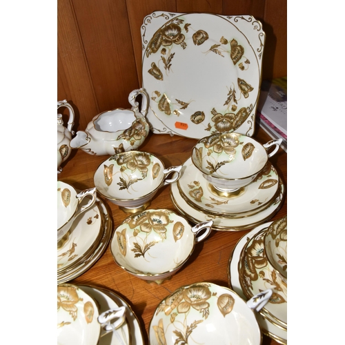 351 - A FORTY TWO PIECE ROYAL STAFFORD TEA SET, decorated with gilt poppies on a cream ground, pattern no ... 