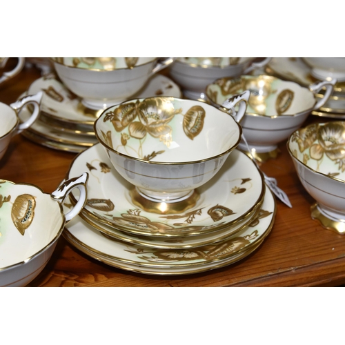 351 - A FORTY TWO PIECE ROYAL STAFFORD TEA SET, decorated with gilt poppies on a cream ground, pattern no ... 