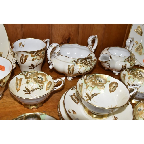 351 - A FORTY TWO PIECE ROYAL STAFFORD TEA SET, decorated with gilt poppies on a cream ground, pattern no ... 