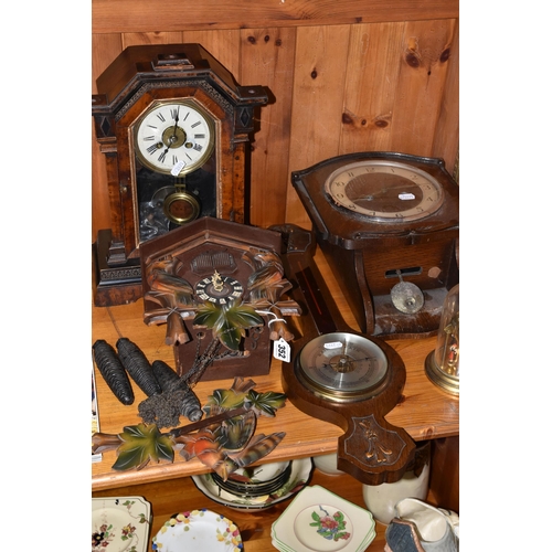 352 - A GROUP OF CLOCKS, comprising a cuckoo clock with weights and pendulum, with cuckoo and guitar playe... 