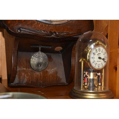 352 - A GROUP OF CLOCKS, comprising a cuckoo clock with weights and pendulum, with cuckoo and guitar playe... 