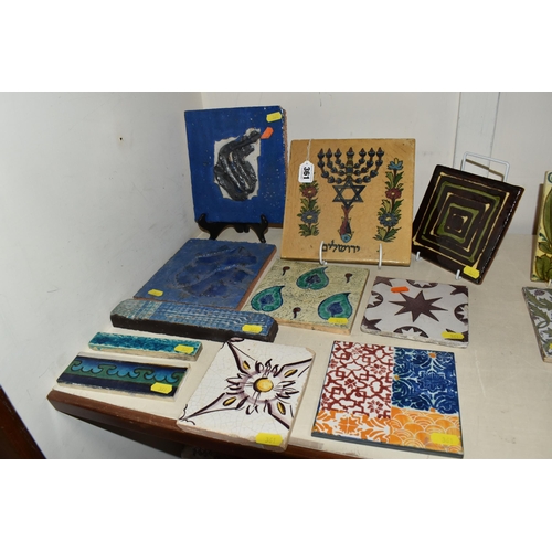 361 - A GROUP OF ELEVEN ASSORTED CERAMIC TILES to include a large glazed Jewish tile depicting a 'seal of ... 